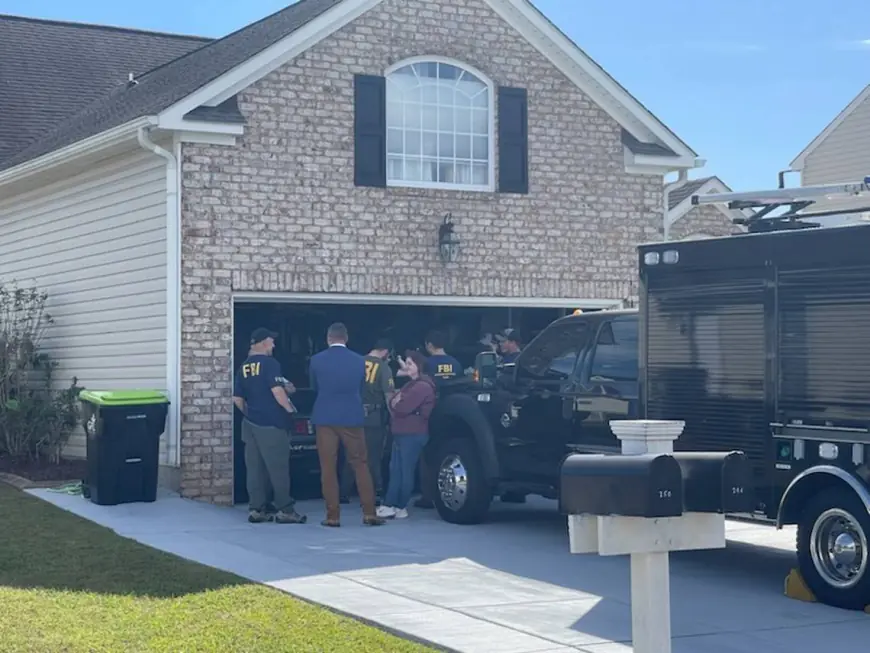 FBI at home of former Myrtle Beach pastor John Paul Miller. Officers searching property