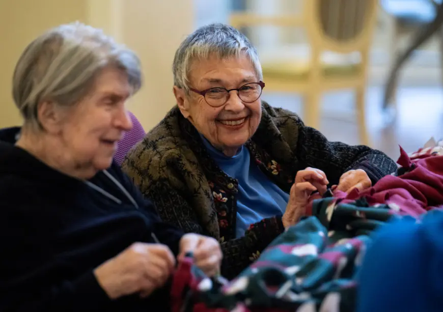 Residents of St. Paul senior center make blankets as gifts for Dorothy Day Center