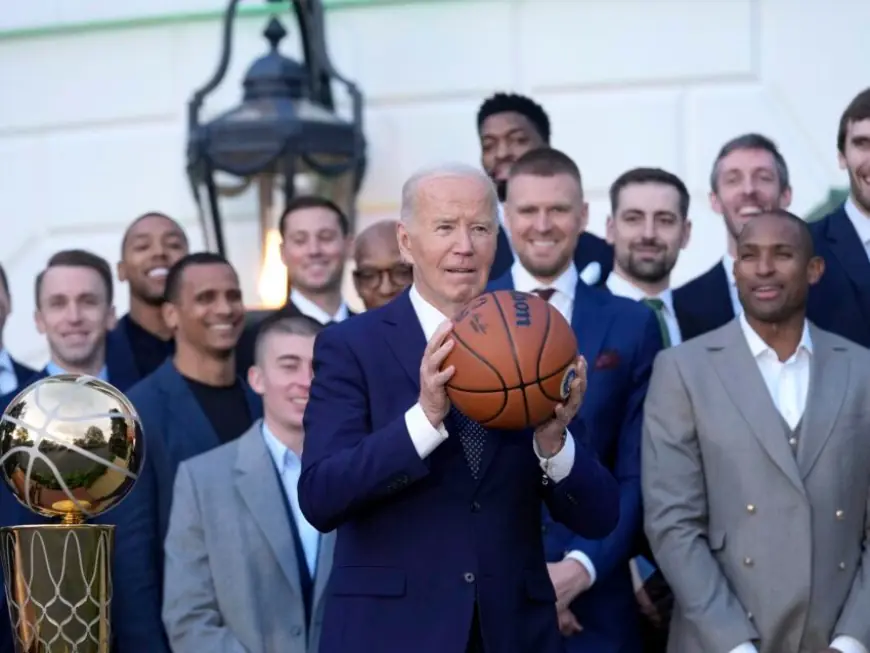 Watch: President Biden pump-fakes a basketball and passes it to Al Horford