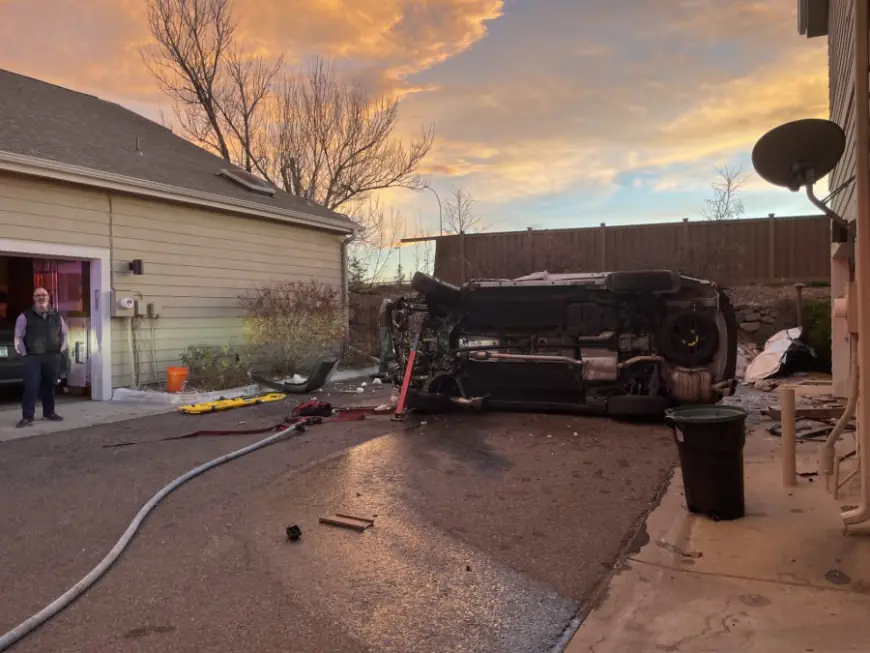 Driver suffers medical emergency, flips car into driveway with homeowner feet away