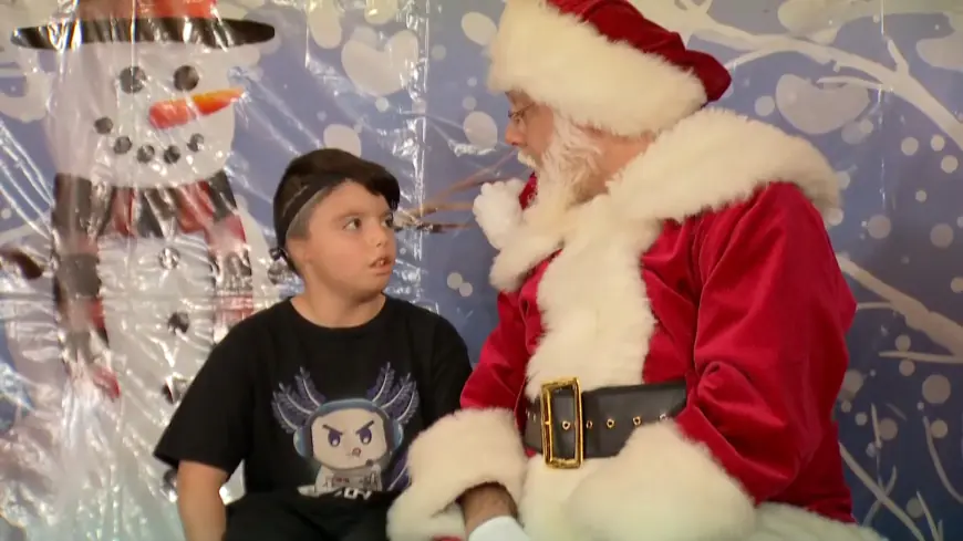 Santa uses American Sign Language to communicate with kids in Aurora