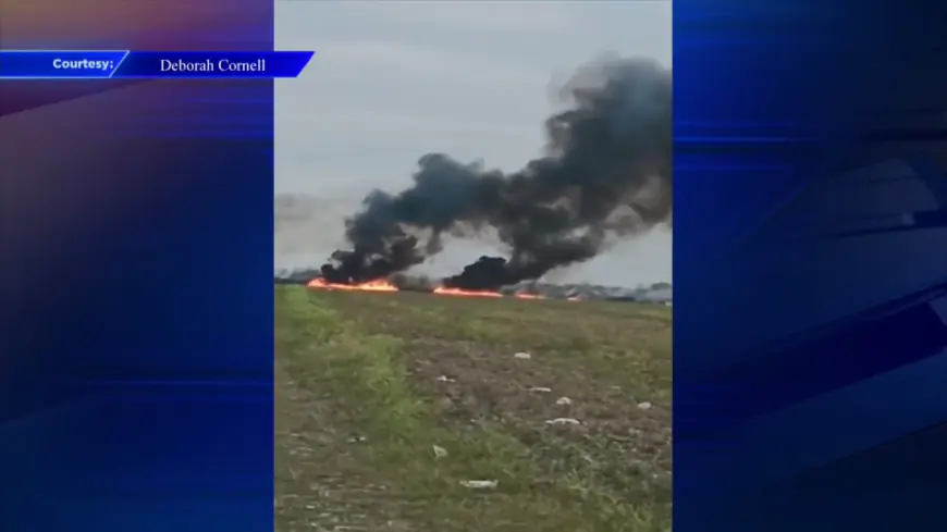 Crews work to extinguish a brush fire in South Miami-Dade