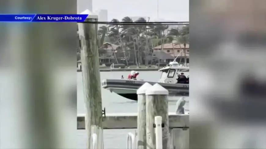 Santa, the Grinch make splashy entrances at Marine Corps Toys for Tots in Miami Beach