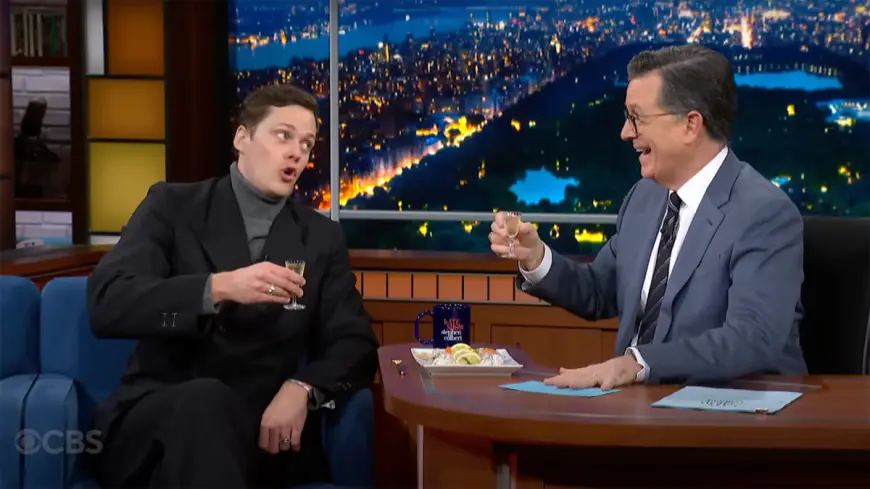 Bill Skarsgård and Stephen Colbert do shots, sing a Swedish Christmas song