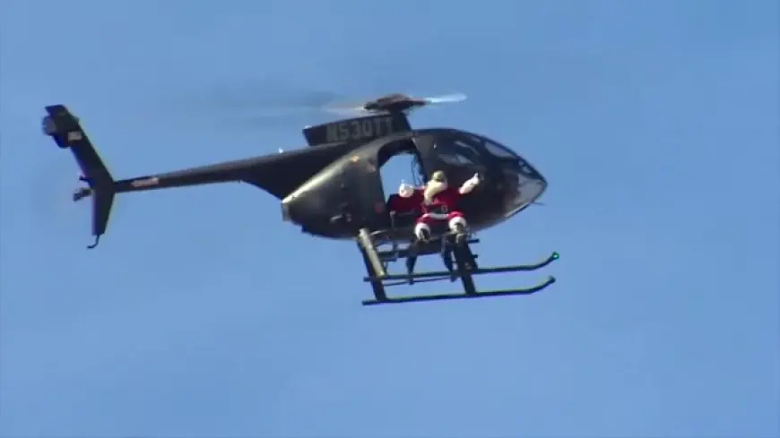 Santa swoops in on chopper for bike and toy giveaway at Sweetwater park