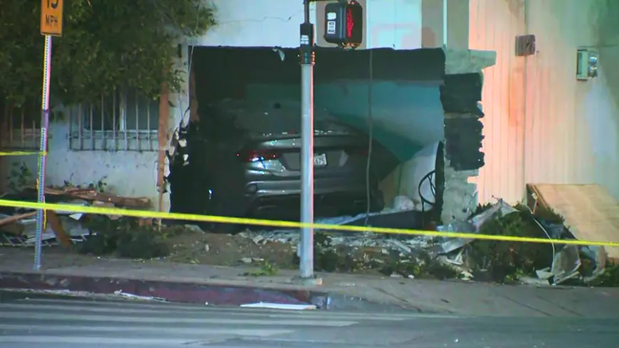 Car slams into Los Angeles apartment building, killing person inside