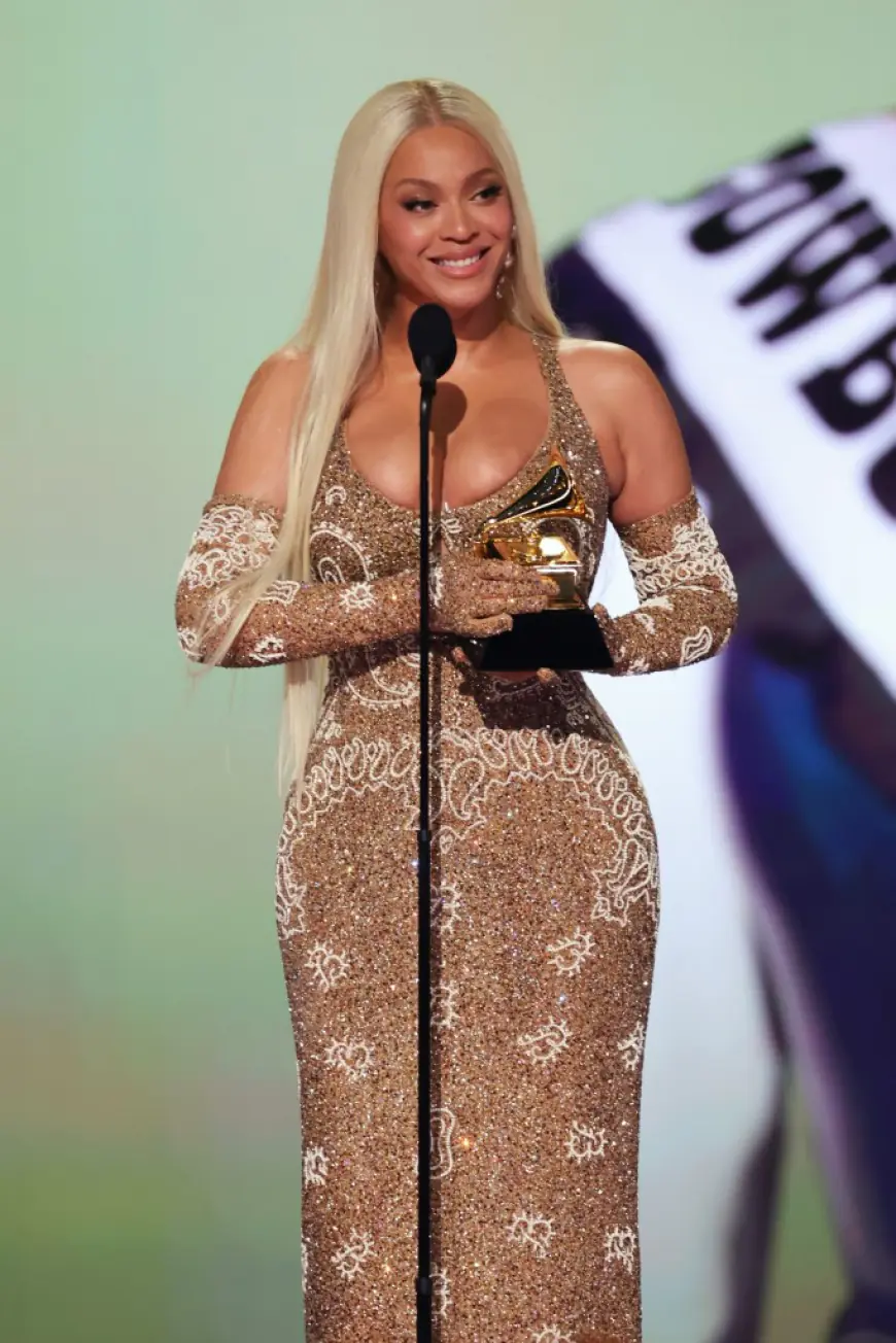 Beyoncé goes for Western glam in gold paisley gown and matching gloves at Grammys 2025