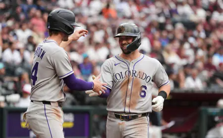 Rockies hit five homers, beat Diamondbacks 14-12 for rare road win