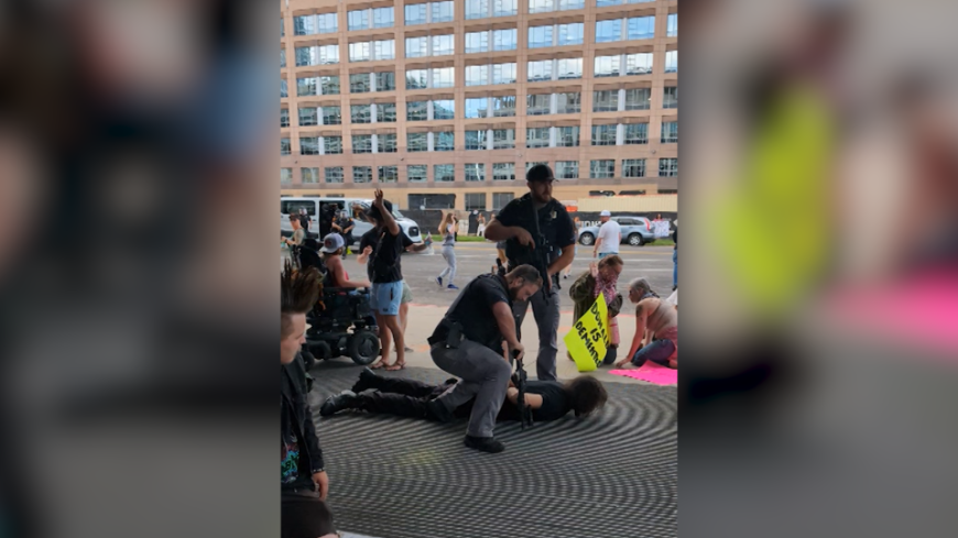 ‘He’s right there’: Bystander flags man with rifle to police at ‘No Kings’ protest